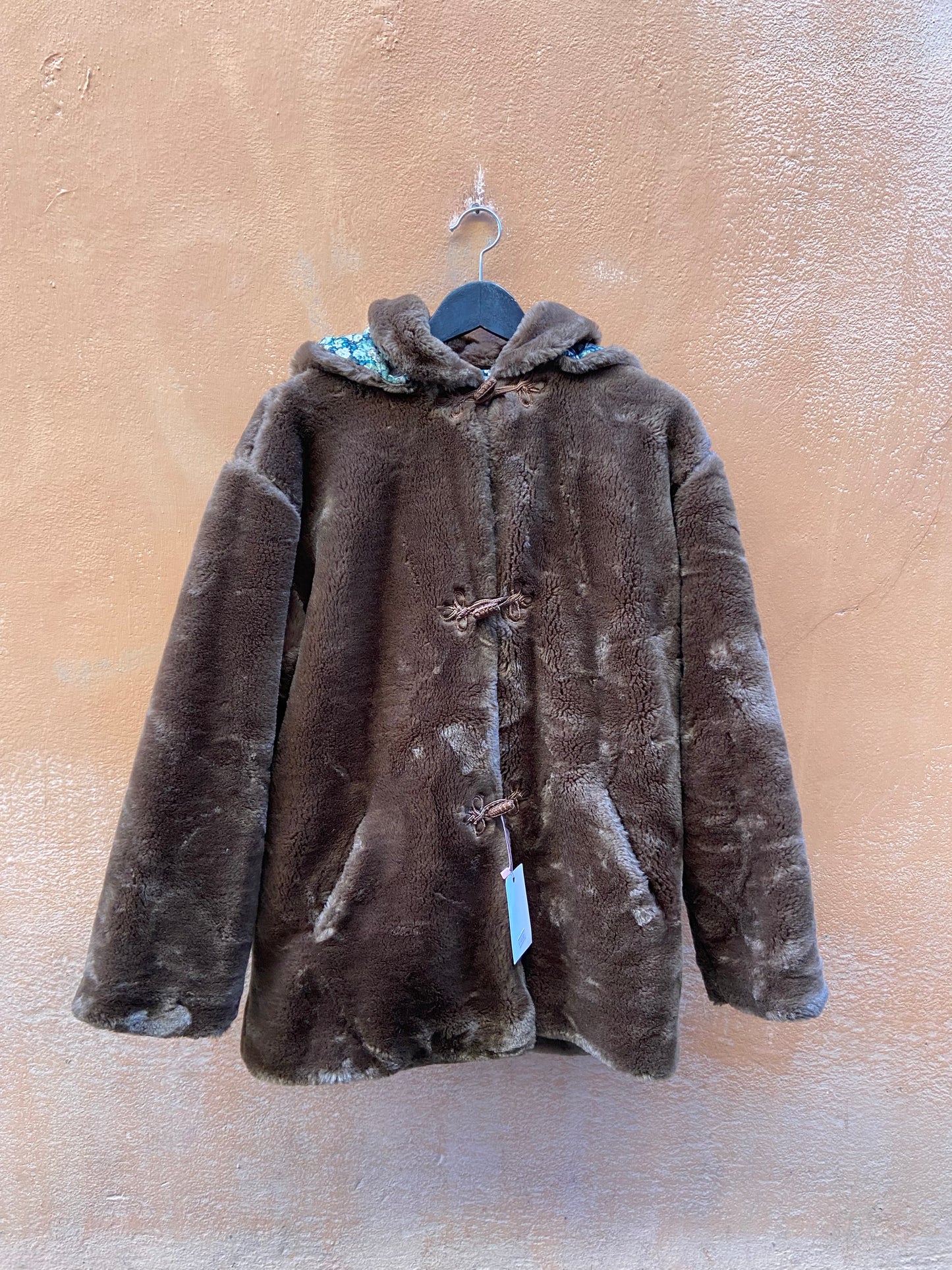 Eco pelliccia con cappuccio